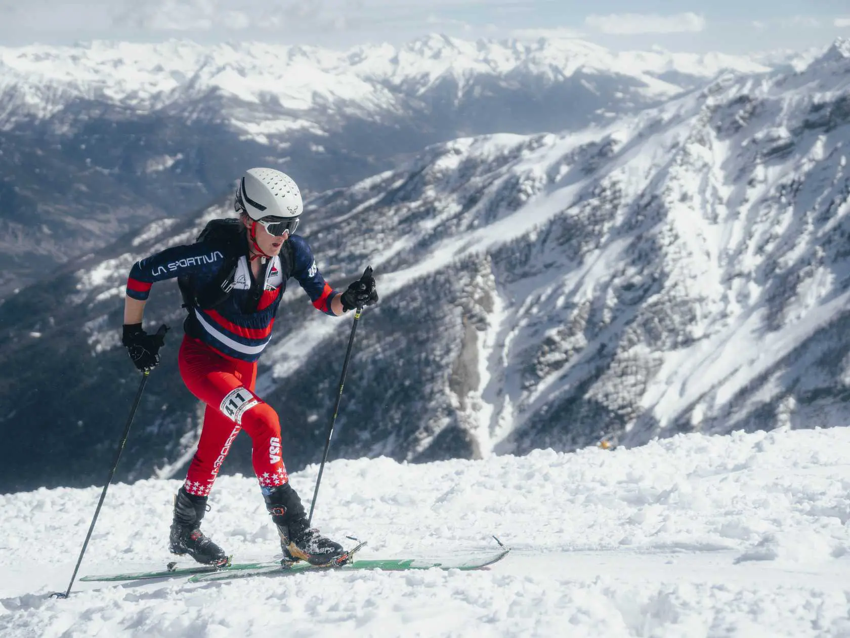 Skier touring in winter mountains