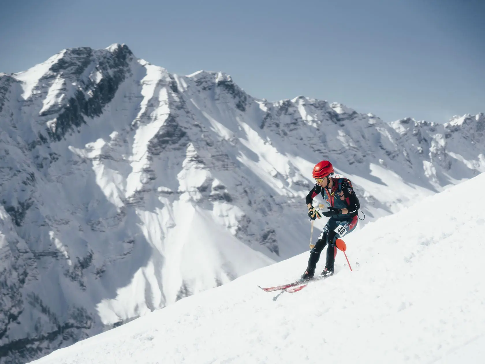Skier descending snowy mountain