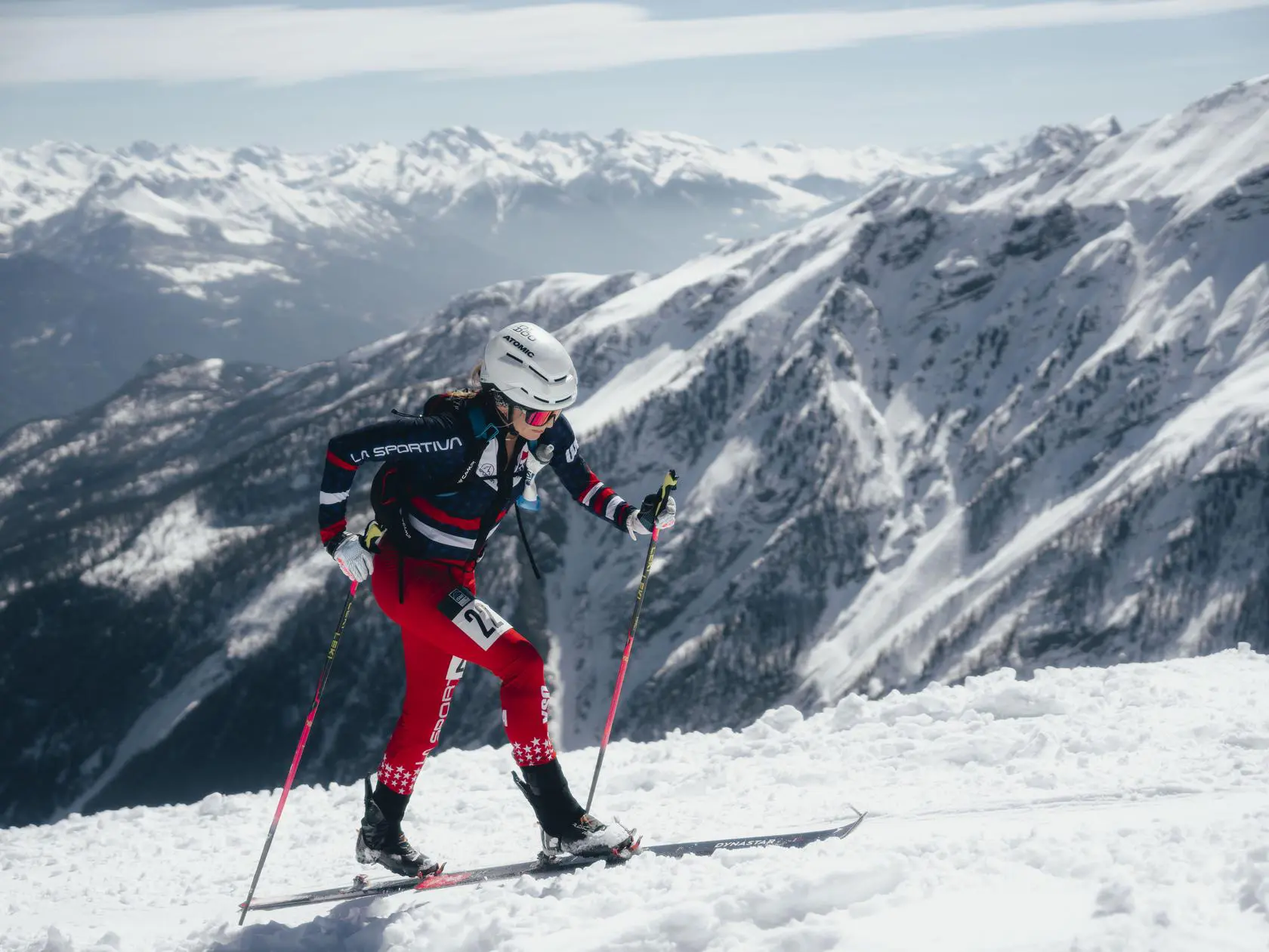 Skimo racer climbs snowy mountain