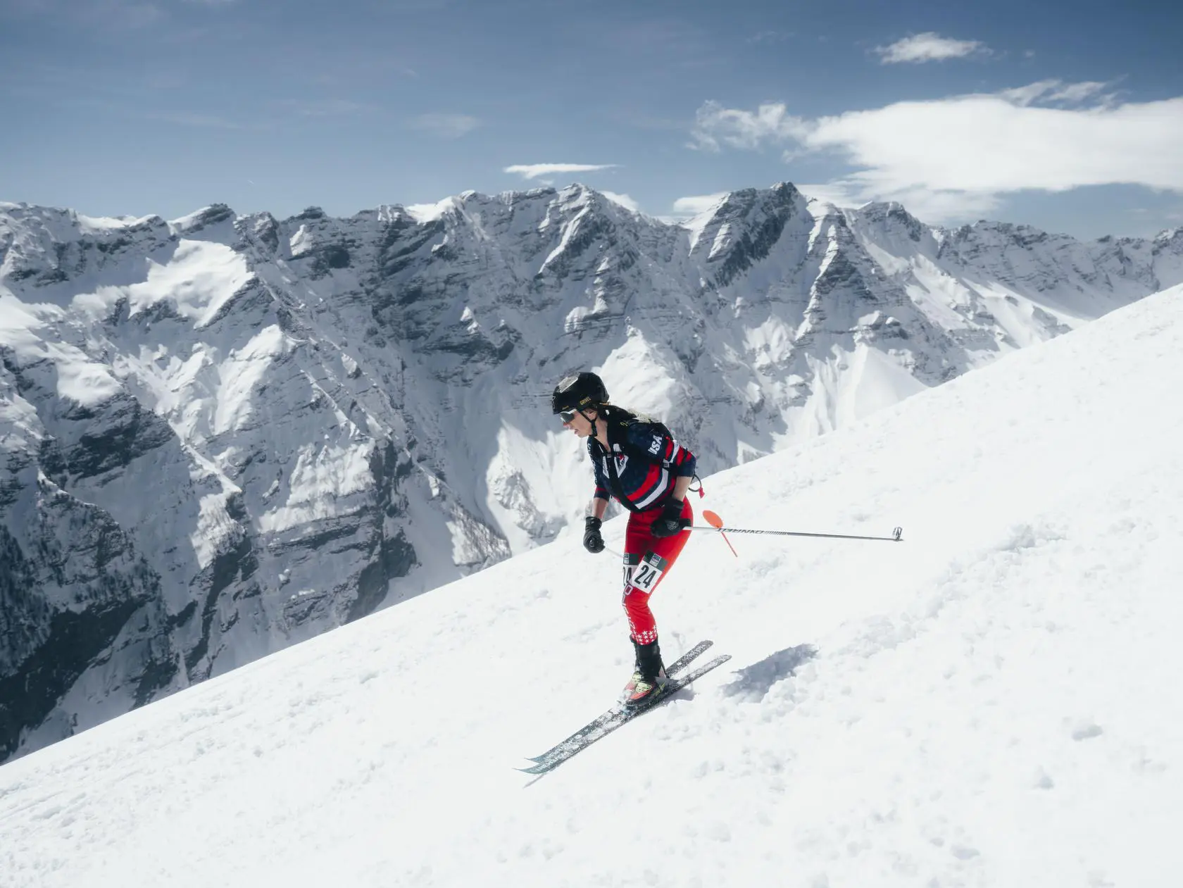 Skier with USA jacket on snowy mountain