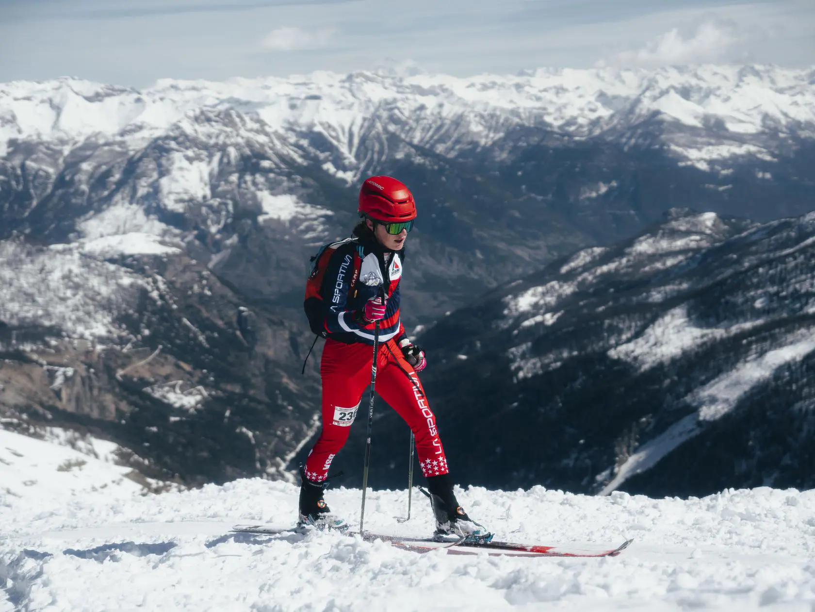 Ski mountaineer ascending snowy peak