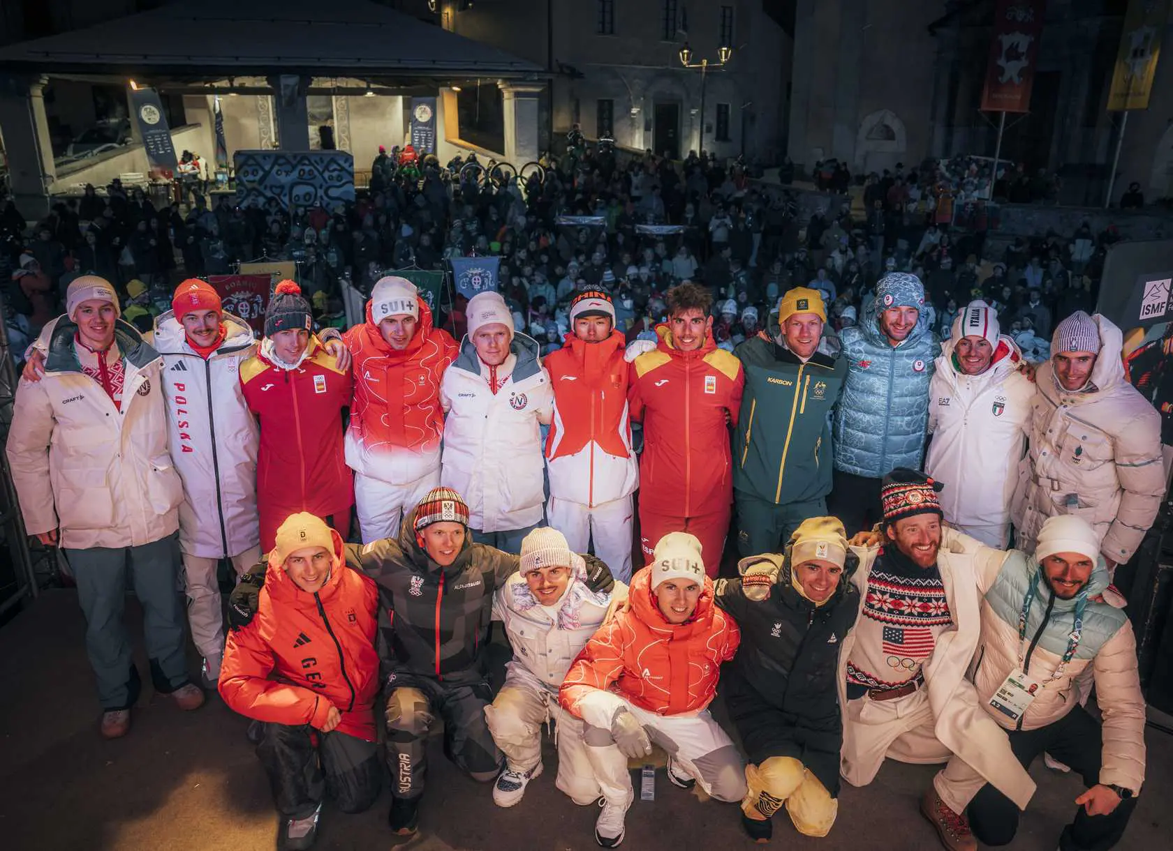 Ski mountaineering athletes group photo at night
