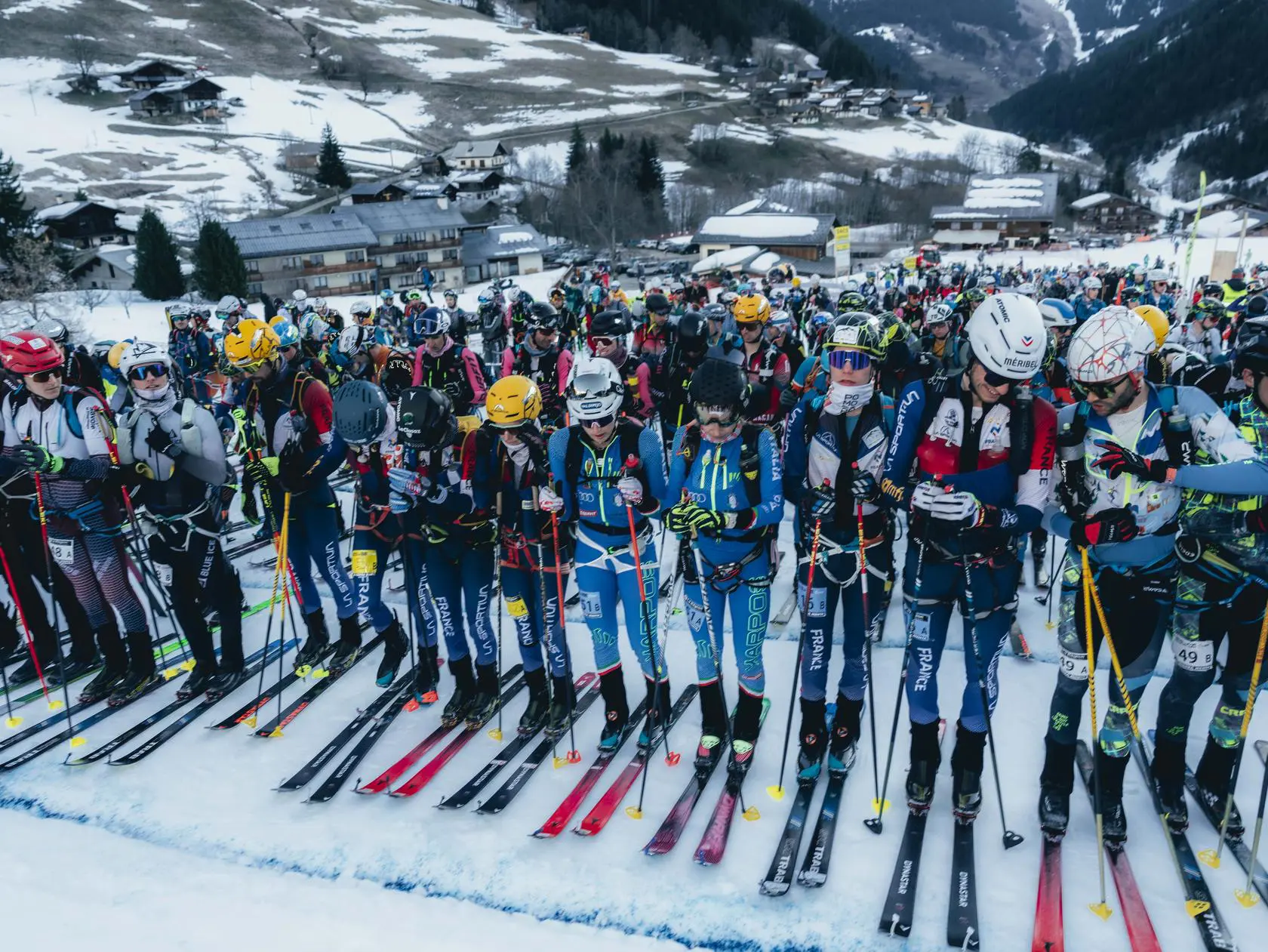 Athletes on skis at snowy mountain race
