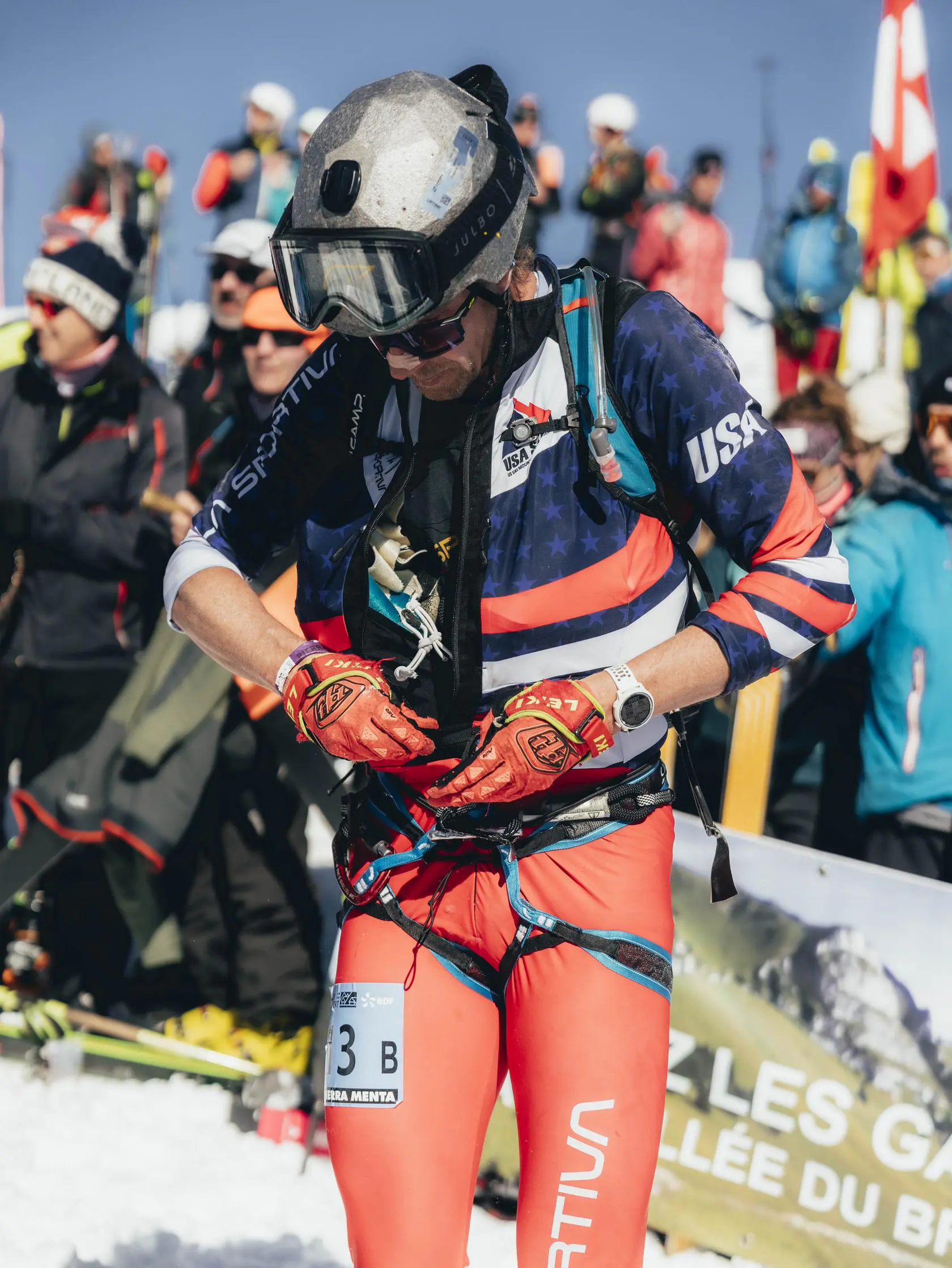 Athlete in USA uniform on snow