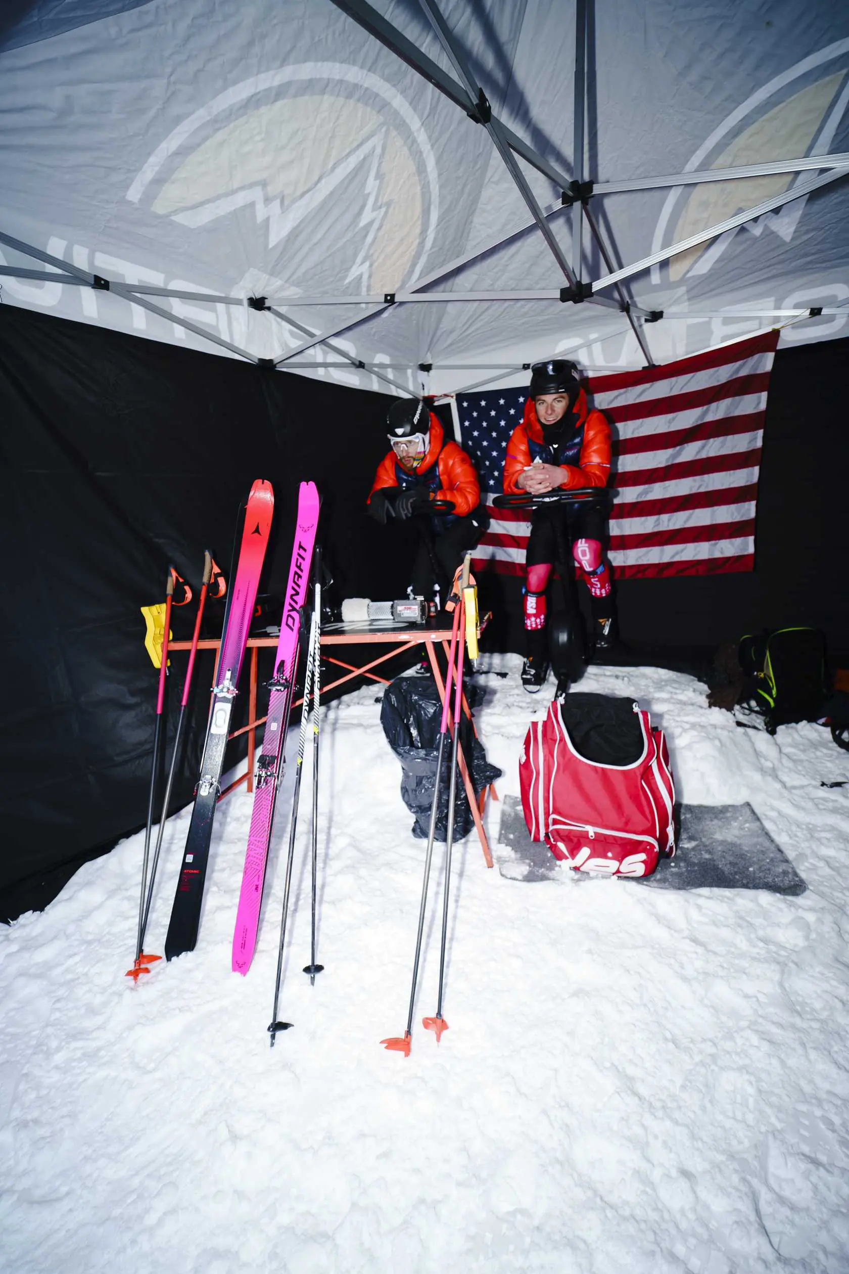 Athletes resting under canopy