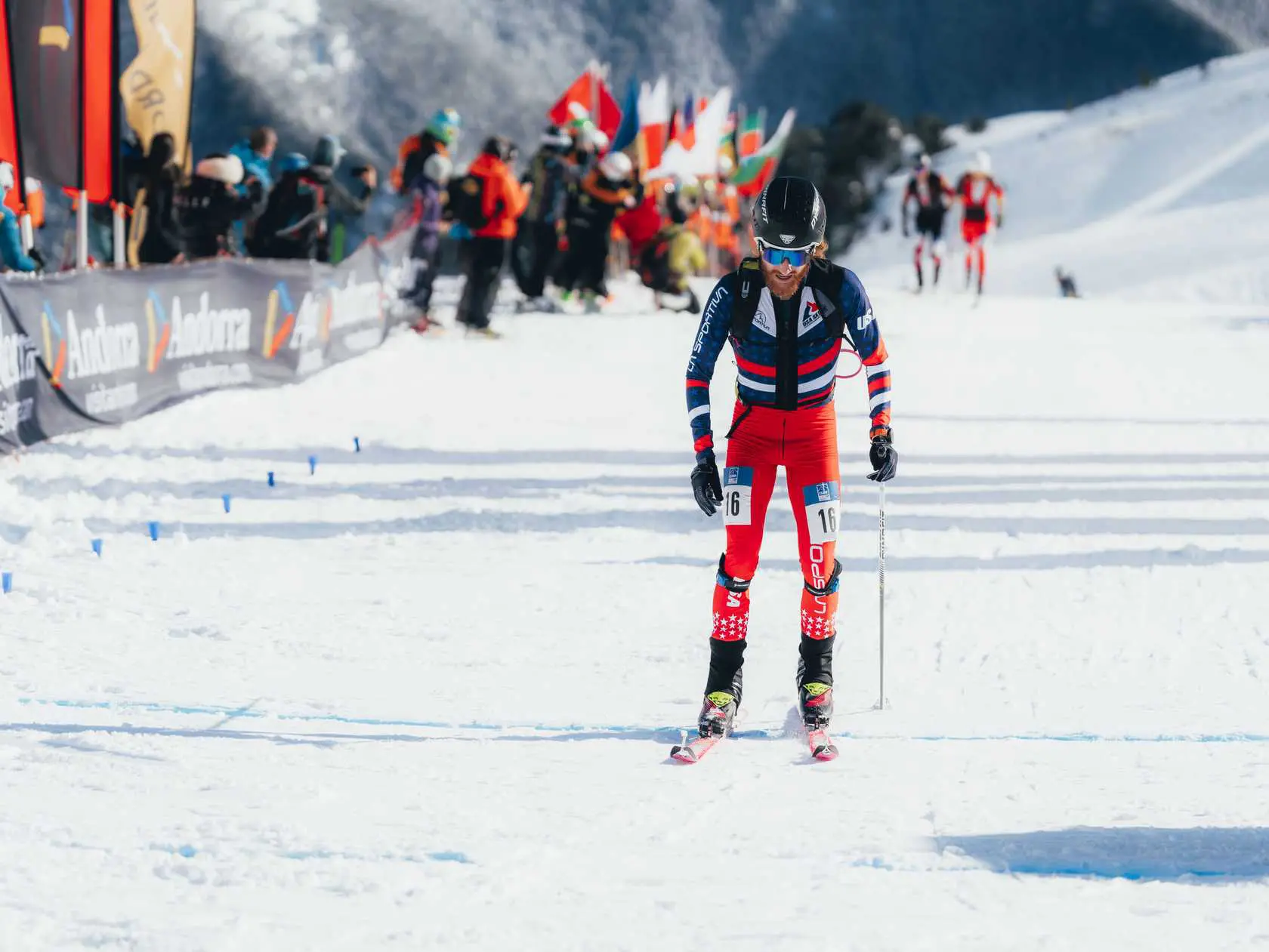 Skier number 16 on a snowy slope.