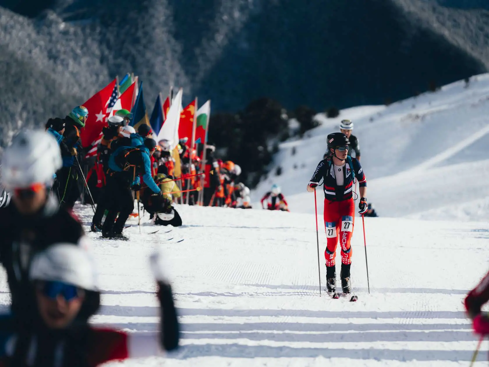 Ski mountaineering race with international flags