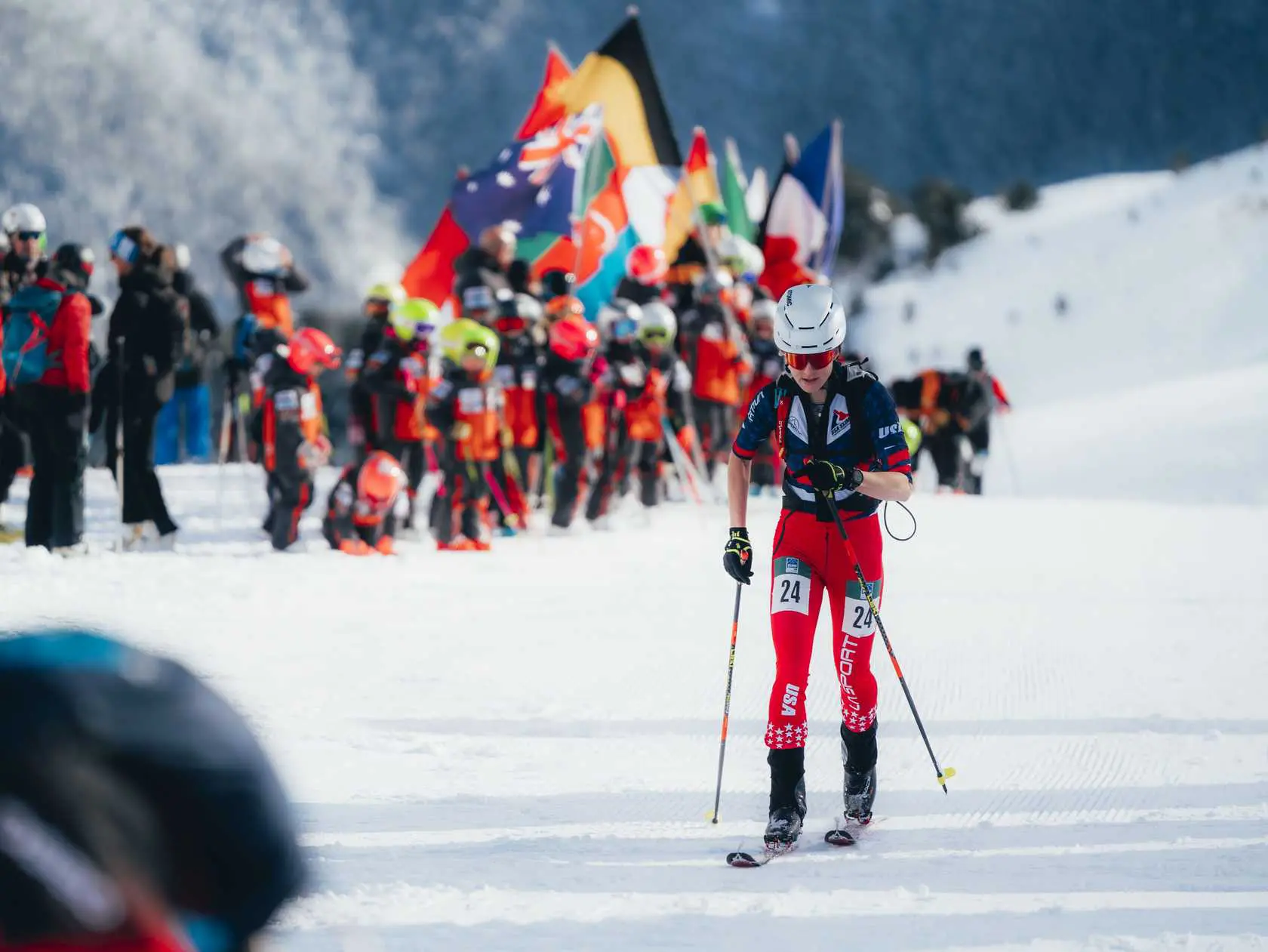 Skier with number 24 on a snowy slope