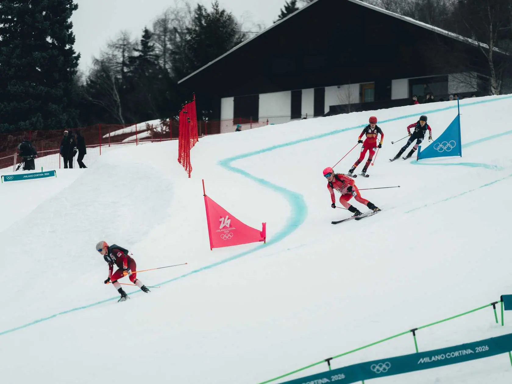 Four skiers competing in a winter race.