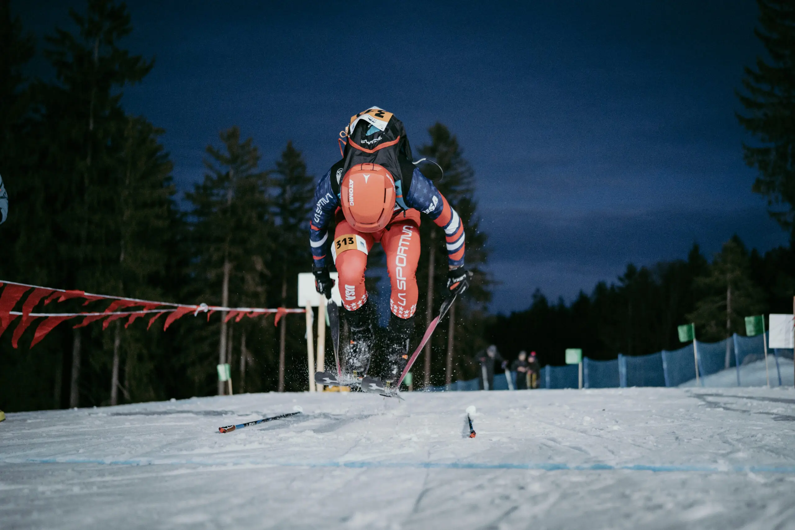Skier jumping on snowy mountain