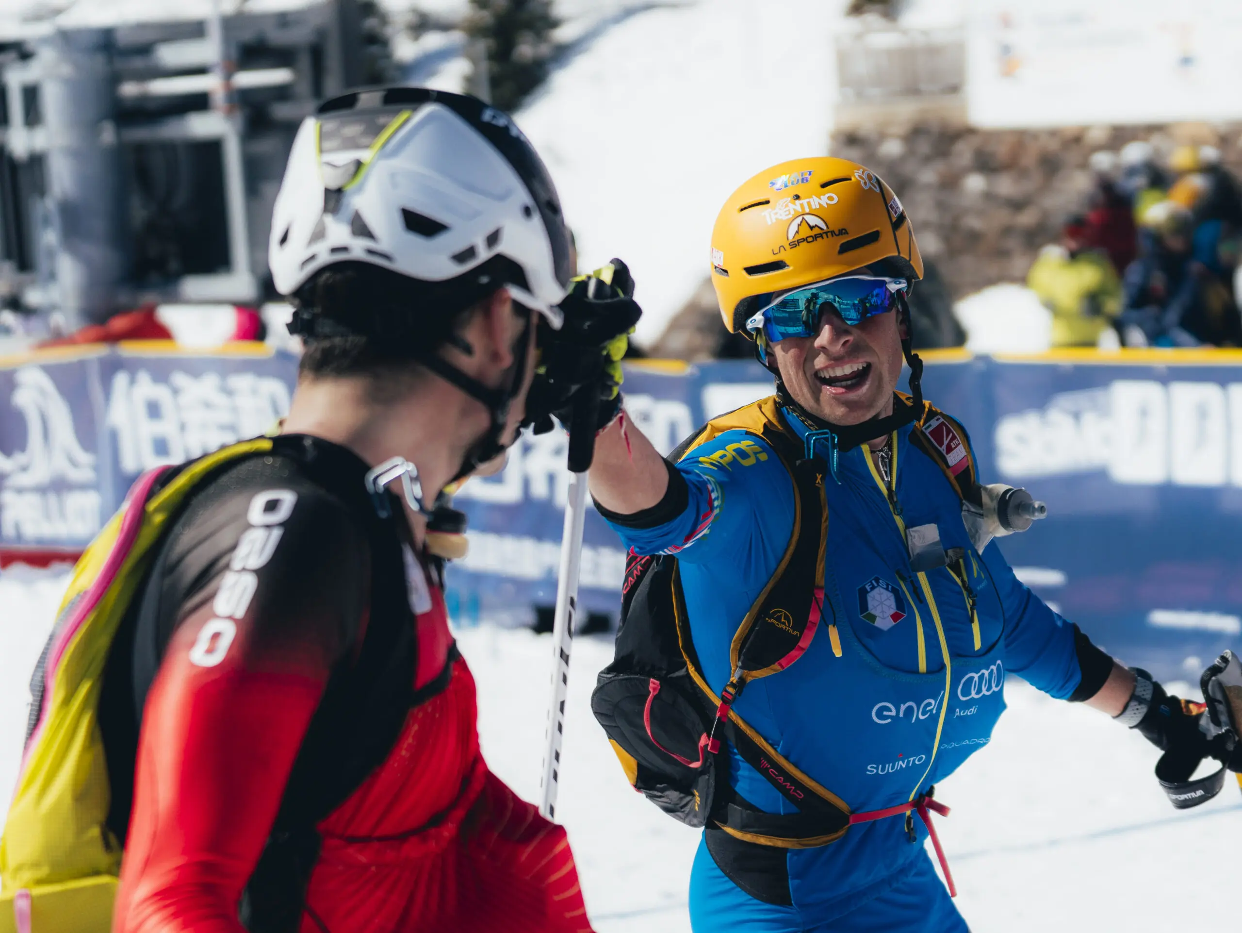 Two ski mountaineers in race gear.