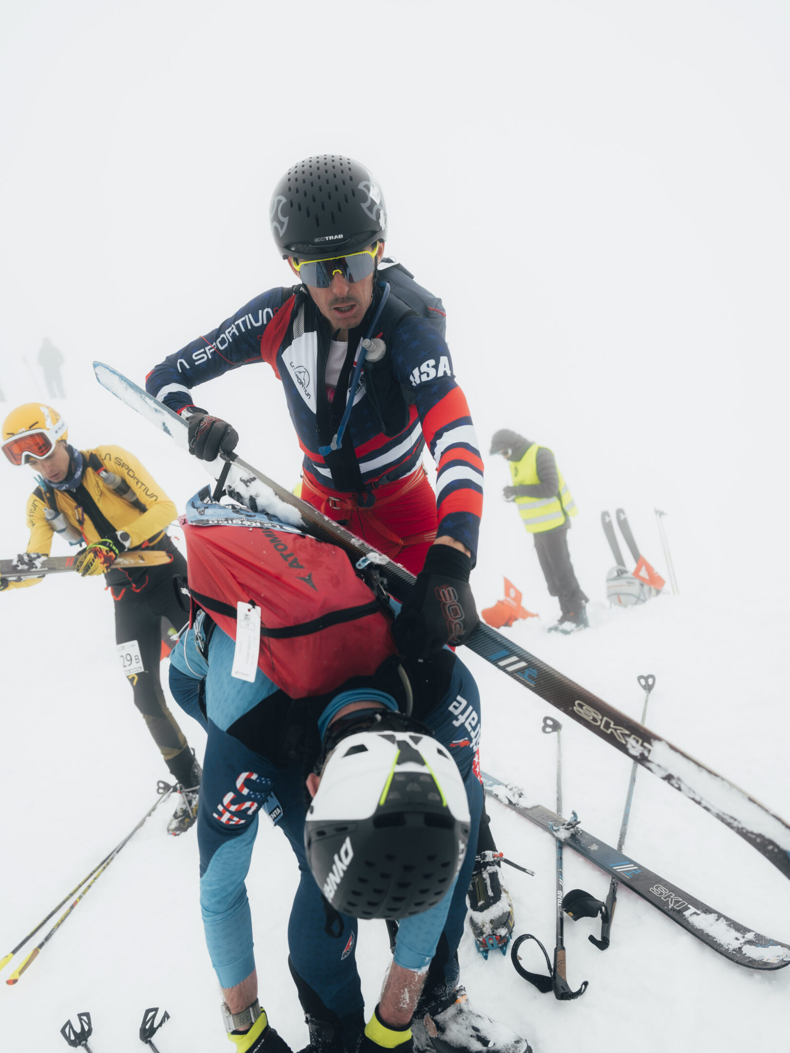 Skiers in USA gear on snowy mountain