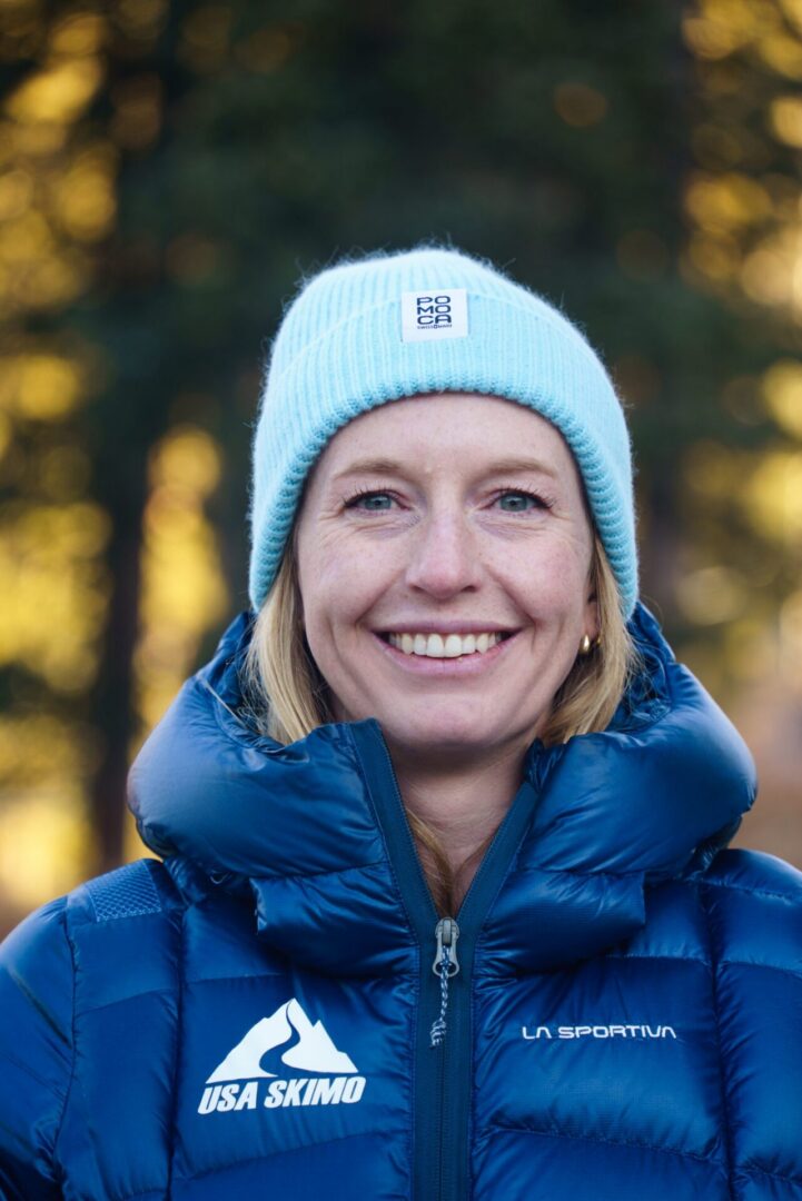 Woman in a jacket and hat at the camera